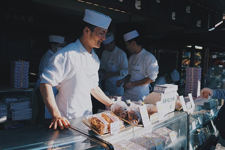 Chefs plating a dish at The Mist